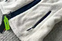 The zippered pocket on the Ororo Women’s Heated Recycled Fleece Vest