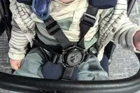 A child seated in the Peg Perego Volo Compact Stroller