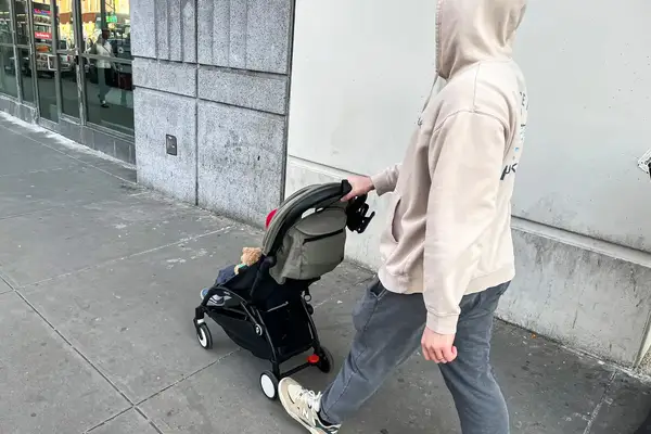 A person pushes a child in the Stokke YOYO³ Stroller