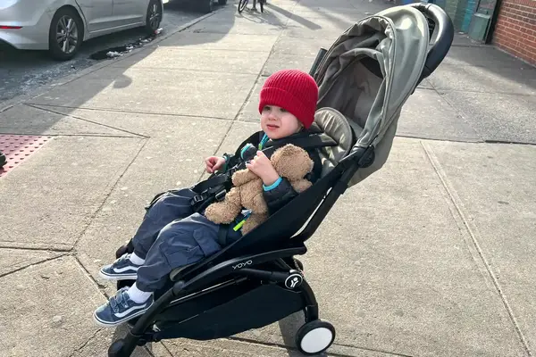 A child sits in the Stokke YOYO³ Stroller