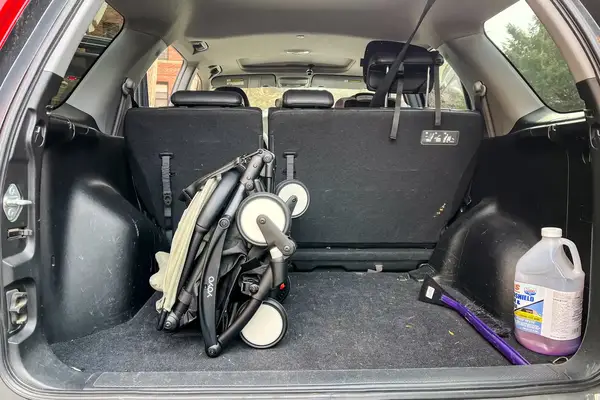 The Stokke YOYO³ Stroller folded up in the back of a car