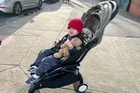 A child sits in the Stokke YOYO³ Stroller