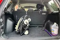 The Stokke YOYO³ Stroller folded up in the back of a car