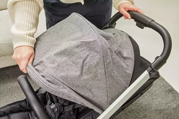 A person opening the hood of the Thule Shine