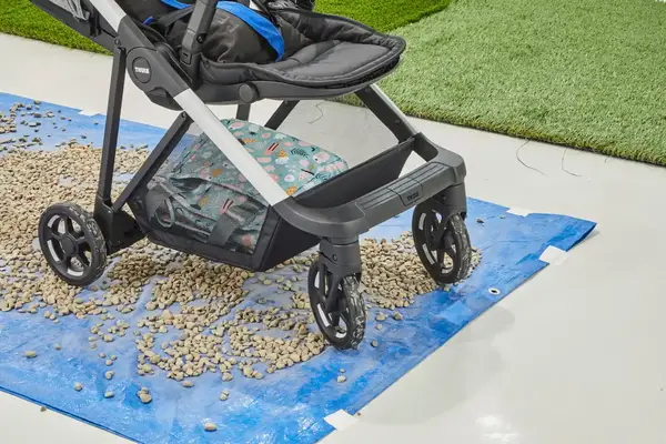 The Thule Shine on a blue plastic sheet filled with small rocks