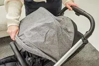 A person opening the hood of the Thule Shine