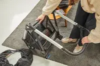 A person assembling the Thule Shine