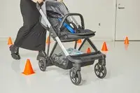 A person moving the Thule Shine through cones