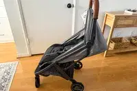 A side view of the Uppababy Minu V3 Travel Stroller