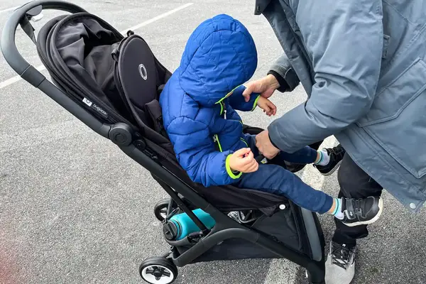 A child is placed in the Bugaboo Butterfly Stroller