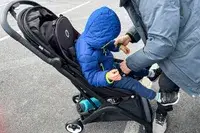 A child is placed in the Bugaboo Butterfly Stroller