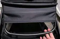 A person touches the handle on the Bugaboo Butterfly Stroller