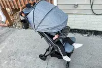 A child in the Zoe The Traveler Stroller