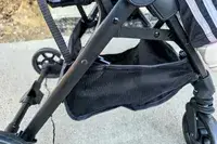 The pocket on the bottom of the Zoe The Traveler Stroller