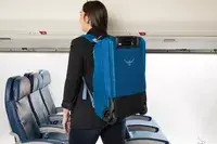 A person wearing the Osprey Daylite Wheeled Duffel 40L on their back