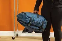 A person wears the Cotopaxi Allpa 42L Travel Pack