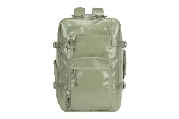 Person putting clothes inside Matein Travel Backpack 40L