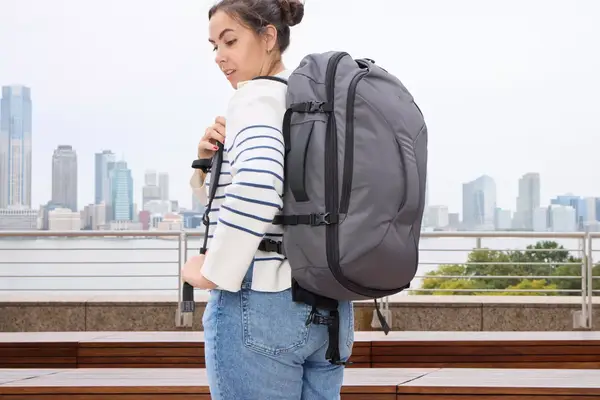 A person wears the Pacsafe Venturesafe EXP45 Anti-Theft Carry-On Travel Pack