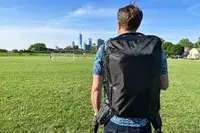 Man wearing the Tortuga Travel Backpack 40L outside