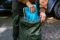 Person packing a Osprey Kestrel 58L Men
