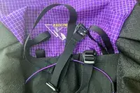 Close-up of ULA Equipment Circuit straps and purple-checkered fabric