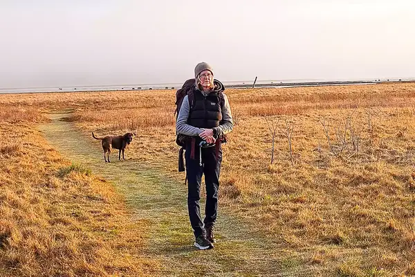 A person hikes outside while wearing the Gregory Women
