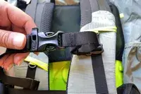 Hands adjusting a fastener on a Gossamer Gear Mariposa 60 Backpack strap