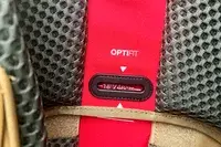 Close-up of a The North Face Trail Lite 50 Backpack back panel with a size adjustment system labeled as Optifit