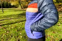A person putting their hand in the pocket of the Cotopaxi Women
