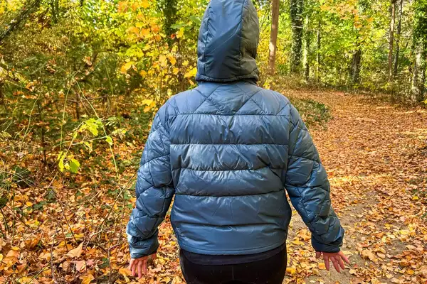 Person wearing Hikerkind Packable Down Puffer 0.1 on a hike.