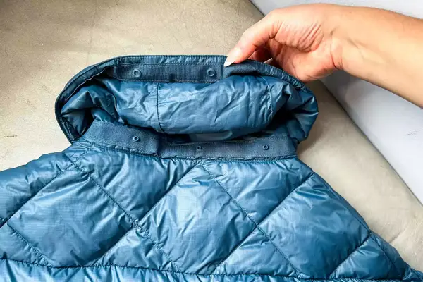 Hikerkind Packable Down Puffer 0.1 unbuttoned collar.