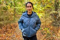 Person wearing Hikerkind Packable Down Puffer 0.1.