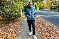 Person wearing Hikerkind Packable Down Puffer 0.1.