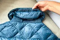 Hikerkind Packable Down Puffer 0.1 unbuttoned collar.