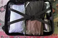 An L.L.Bean Women’s PrimaLoft Packaway Jacket folded inside an open suitcase