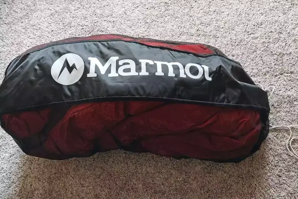 The Marmot Lost Coast 40° Sleeping Bag inside a storage bag
