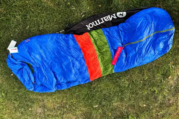 The Marmot Sawtooth 15 Sleeping Bag on grass