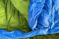 The Marmot Sawtooth 15 Sleeping Bag folded over exposing the inside