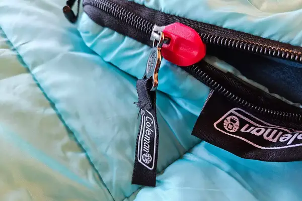 A branded zipper on the Coleman Flatlands Fleece 30°F Double Sleeping Bag