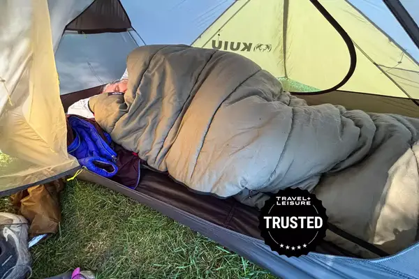 Guide Gear Sleeping Bag with a person in a tent asleep