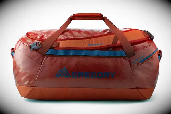 A person wears the Away The Outdoor Convertible Backpack 45L next to airplane seats