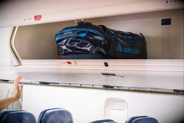 The Gregory Alpaca Duffel 60L in an overhead compartment