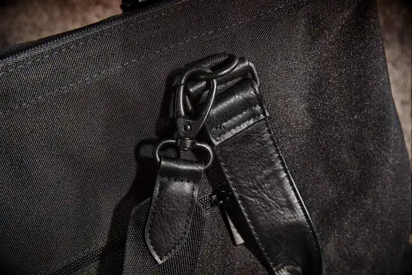 A close up of the removable strap on The Convertible Weekender