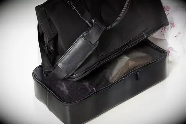 A close up of the The Convertible Weekender with the removable bottom zipped off