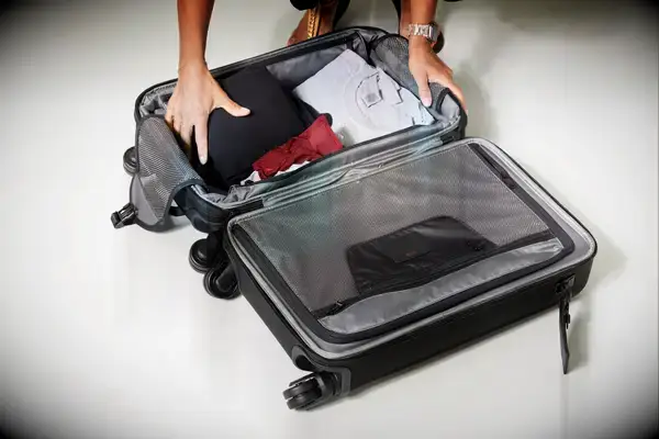 Three women on a mountain with hiking backpacks