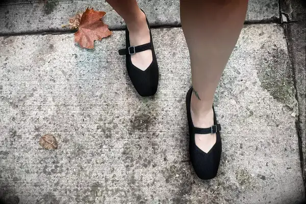 Person wearing Raen Aren Sunglasses while outdoors around snow