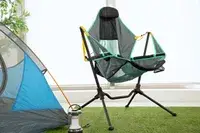 NEMO Moonlite Reclining Camp Chair on grass next to a tent
