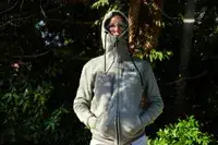 A person wearing a fully zippered Gobi Heat Ridge Women