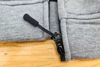 A close-up of the bottom of the zipper of the Gobi Heat Ridge Women