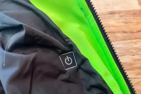 A close-up of the power button of the Conqueco Men